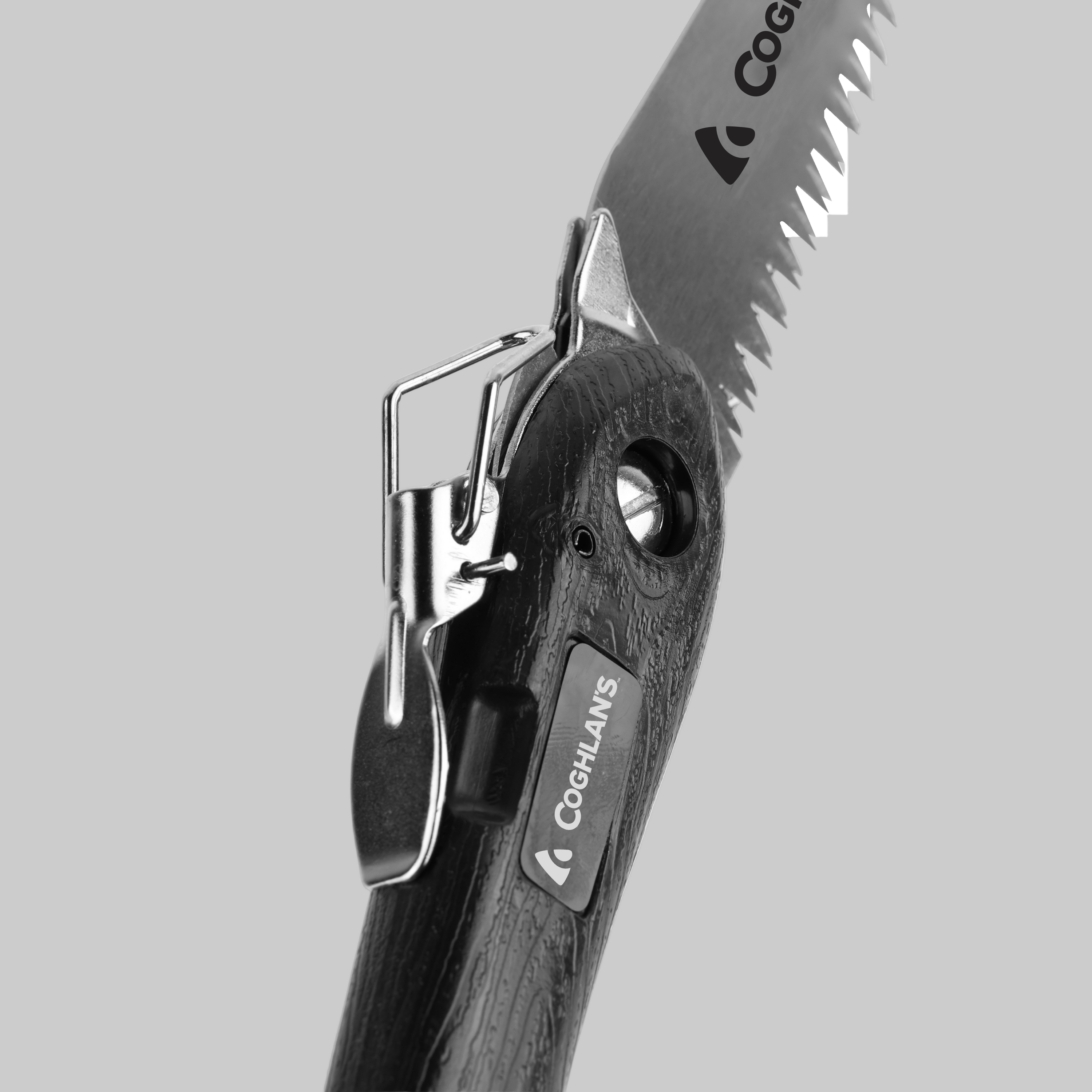 Close-up of a folding pocket knife with a saw blade, branded &