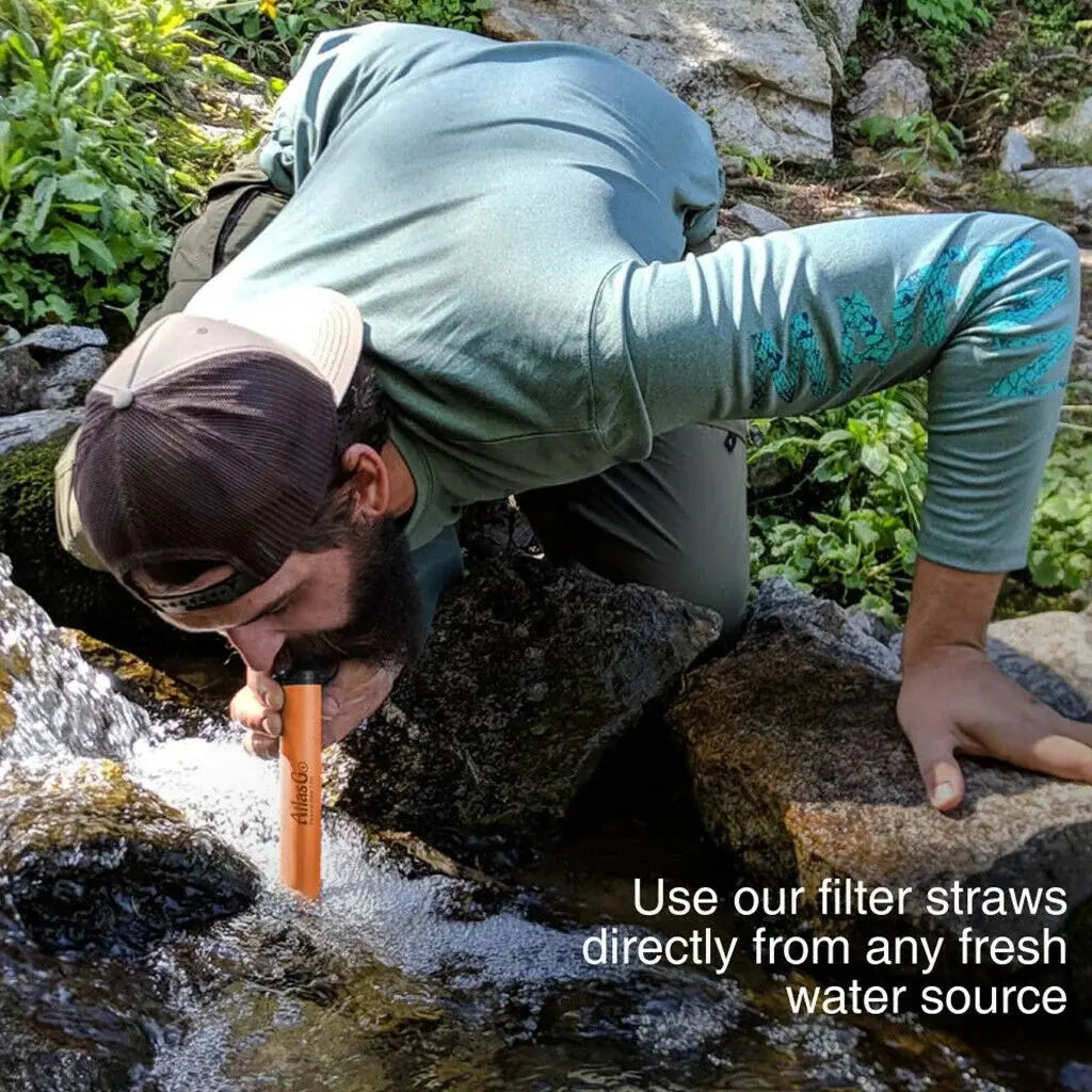 AtlasG Personal Water Filter - man drinking from stream
