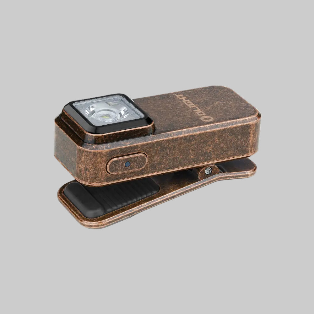 A Olight Oclip Clip Light by Urban Go Prep