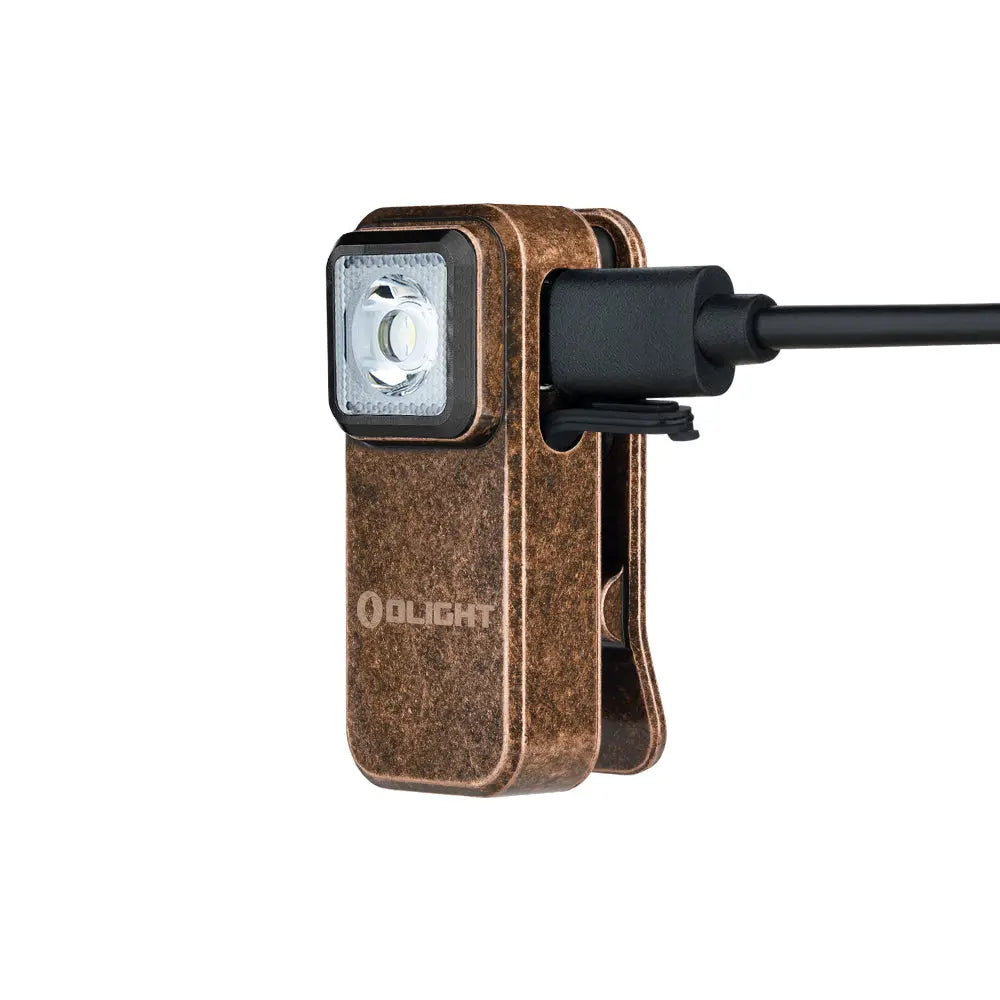 A Olight Oclip Clip Light by Urban Go Prep