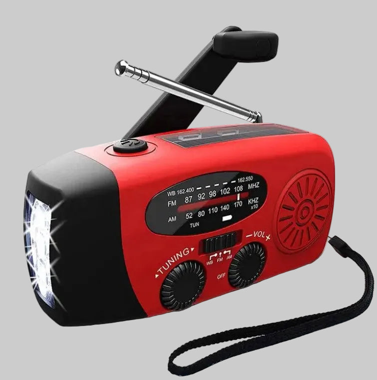 Red and black emergency radio with flashlight on a white background