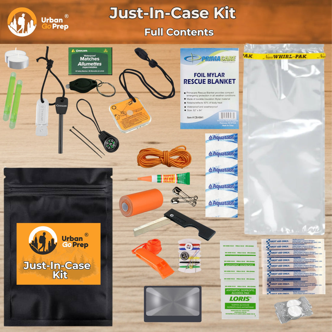 Urban Go Prep Just-In-Case Kit full contents laid out on a light wood background, including a black zippered kit pouch with an orange logo, a large clear plastic water reservoir bag, a blue rescue blanket, first aid items, orange tape, metal tools, and other emergency preparedness accessories.