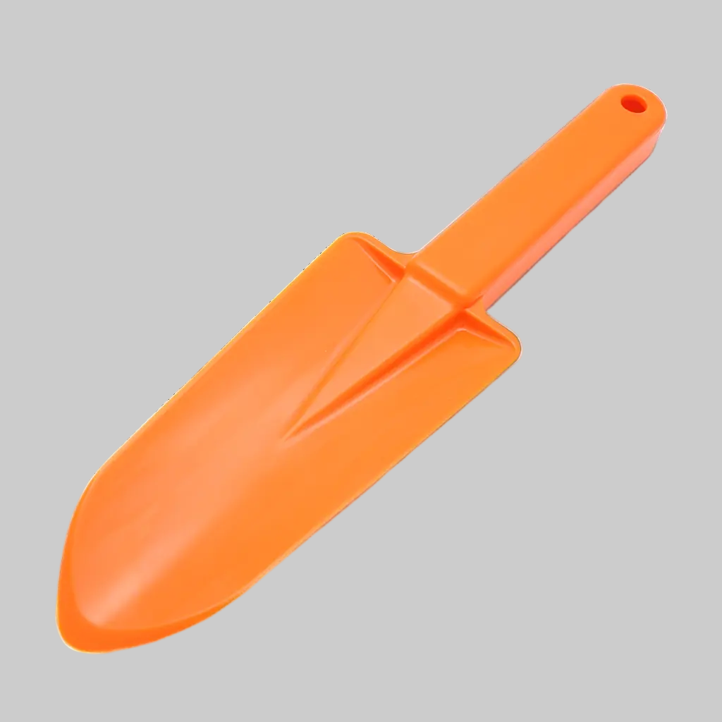 Orange camp trowel on a gray background
